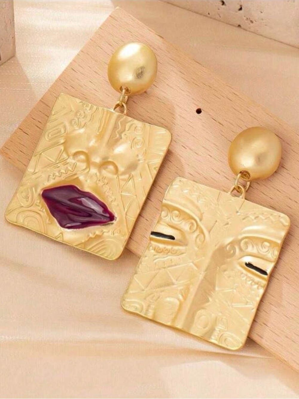 New Arrivals! Gold-tone Sculpted Face Drop Earrings with Burgundy Accent